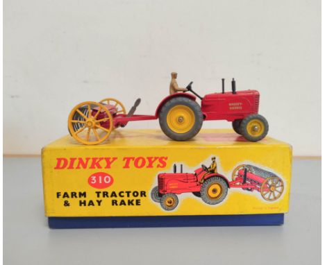 Dinky Toys. Boxed die-cast Farm Tractor &amp; Hay Rake 310.&nbsp; 