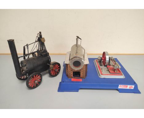 Wilesco. Wilesco D12 steam engine raised upon blue metal base, together with a die-cast model of an early steam engine possib