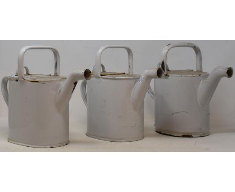 Three white enamel watering cans, a leather jewellery box, and a metal box (5) 