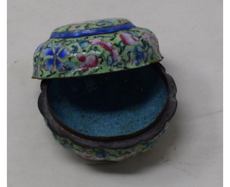 A Canton enamel pot and cover, decorated with flowers on a green ground, 3 cm diametersee images 