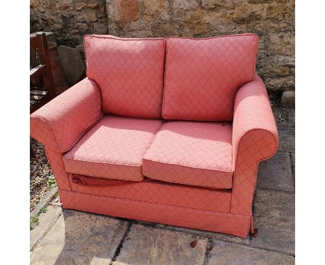 A pink sofa bed, 128 cm wide 