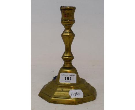 An 18th century style brass candlestick, with knopped stem, on octagonal foot, 20 cm high 