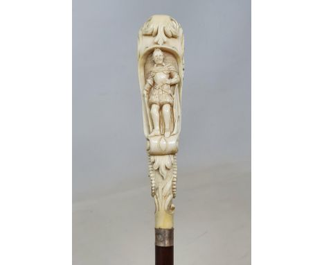 A 19th century fruit wood walking stick, with carved ivory handle in the form of a lion emerging from a scroll, with an Eliza