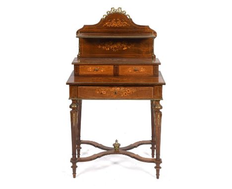 A French rosewood bonheur du jour, with brass mounts, the superstructure with a shelf and two small drawers, the base with a 