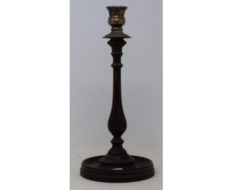 A 19th century mahogany and silver plated candlestick, on a circular foot, 34 cm 