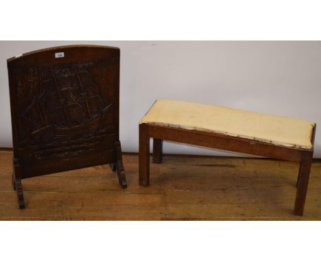 An Arts and Craft style oak stool, 83 cm wide, carved oak firescreen, 50 cm wide (2) 