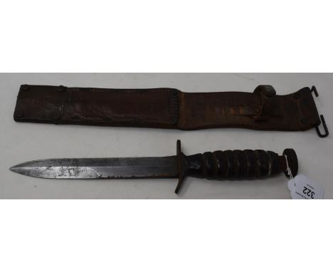 A WWII American M3 combat knife, the 17 cm single edged blade with sharpened back edge point, stamped US M3 AERIAL MARNINETTE