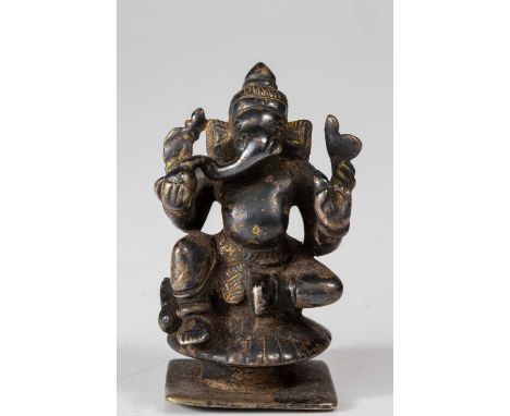 SilverIndia, 18th century Dimensions: Height 7 cm Wide 5 cm Depth 4 cmWeight: 272 grams Seated Ganesha on round lotus base at