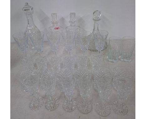 A set of 6 crystal pedestal white wine glasses, no makers mark, 4 decanters, 6 cut glass water glasses, 6 whiskey tumblers, 6