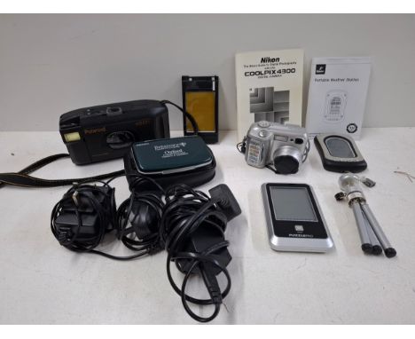 A group of vintage cameras and small electricals to include a Polaroid Vision SLR and a Nikon Coolpix 4300 and a Seiko consol
