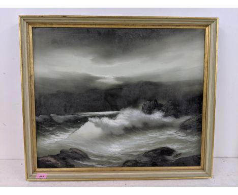 Remo Aldini an oil on canvas, a seascape with rough waves crashing against the rocky shoreline against an angry sky, framed b