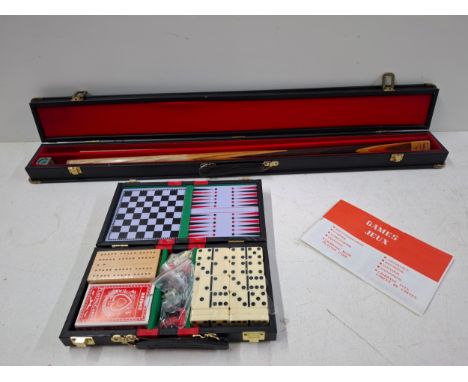 A Rex Williams Midas snooker cue in original case together with a vintage cased games compendiumLocation: A4BIf there is no c