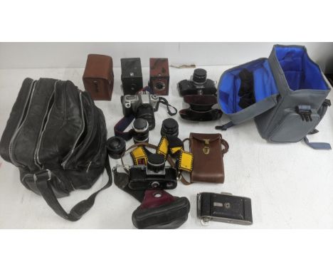 A collection of photographic equipment to include a Yashica Reflex 35 camera, a Miranda Camera, an Agfa camera and others Loc