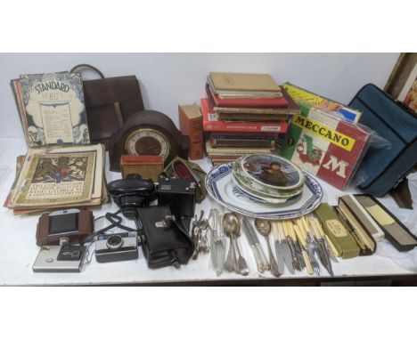 Mixed lot to include plates, a mantle clock, vintage books, flatware, sheet music and camerasLocation:If there is no conditio