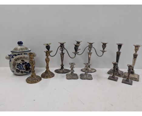 A selection of silver plated candlesticks to include a pair of 3-arm silver plated candelabras, along with a pair of candlest