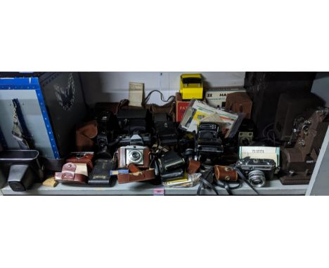 A selection of film cameras, lens', light meters, and other accessories, to include a Yashica 24 TLR camera with twin lens'; 