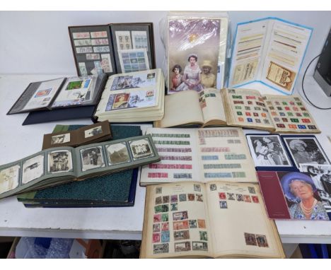A collection of stamp albums and world wide stamps, 1st day covers, albums of family photographs, and early to mid century po