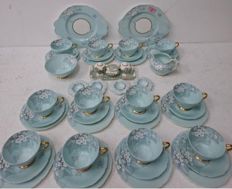 A Paragon duck egg blue and floral 'Primula' part tea set comprising 12 tea cups, saucers and tea plates, a sugar bowl, a mil