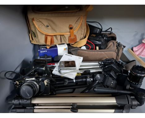 A quantity of photographic and related items to include a JVC camcorder, a boxed Sony mini Handycam, a Pentax Optio M60 camer