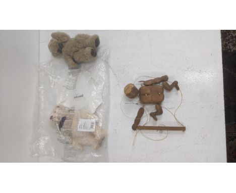 A Steiff Diamond Jubilee bear still in it's sealed packaging with paperwork along with another teddy bear and a pine hand pup