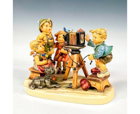 Exclusive Edition M.I. Hummel Club, 25th Anniversary Figural of children posing for picture with dog looking on. Matte finish