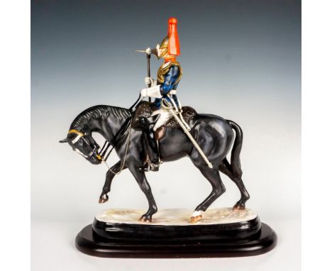 A limited edition equestrian porcelain figure of a Senior Sergeant in British Household Cavalry. Hand painted with heavy hilt