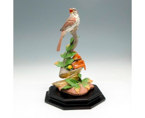 Bird on branch with orange trumpet flowers. Boehm backstamp. This item has a base included 7.25"L x 7.25"W x 1.25"H. Issued: 