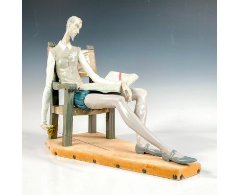 Glossy finish modeled as a large figure of Don Quixote reading, sitting on a stately chair with his sword. Lladro backstamp. 