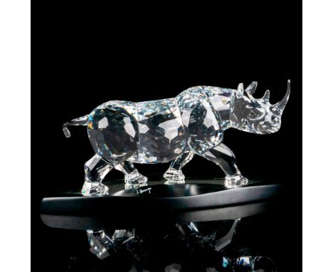 A beautiful clear crystal rhino. Swarovski marking. Certificate of Authenticity included. This item has its original box: 17"