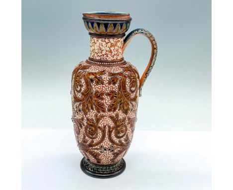 An incised stylized acanthus pitcher. Doulton Lambeth impressed stamp. Artist's initials on the base. Artist: Martha M. Roger