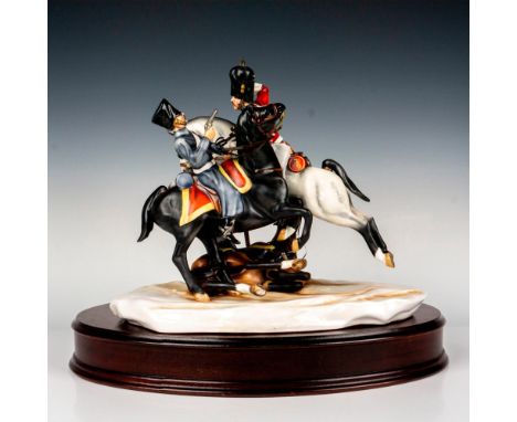 A limited edition piece depicting a military battle. Michael Sutty backstamp. This item has a base included. Base measures: 1