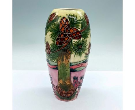 Ovoid-shaped vase depicting a scenic landscape of palm fronds trees. Excellent fine detailed tube lining. Moorcroft and artis