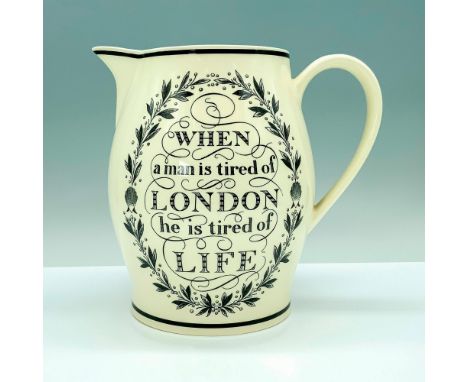 A large cream-colored pitcher with a wide base that has a Samuel Johnson quote and Wordsworth poetry. Wedgwood backstamp. Dim