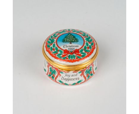 Decorated with festive holly, red ribbons, and central Christmas tree on a snowy hill. Marked with various greetings around b