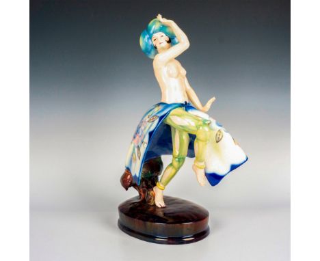 A large art deco style featuring exotic dancer wearing blue turban with bare upper body, underneath a voluminous skirt decora