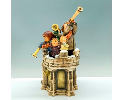 A figure of a snowy castle tower that has five children at the top while a three of them are playing horns. Base titled Centu