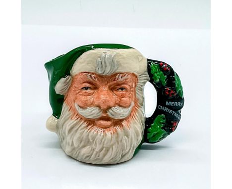 D6900; Santa with a green colorway hat. Holly wreath handle with a banner that reads Merry Christmas. This Item Is The Proper