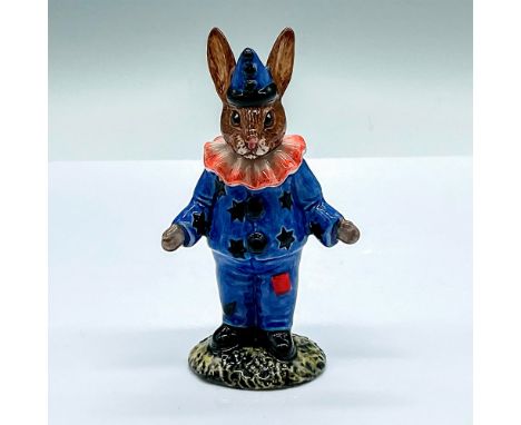 Blue costume with black stars and pompons, red square patch on the trousers, and red ruff on the neck. Royal Doulton backstam