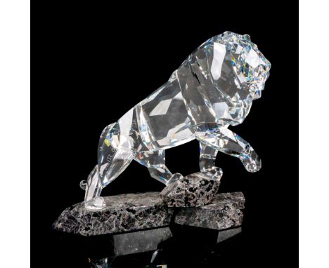 A Soulmates figure on top of a granite base. The clear crystal lion represent the Sprite of Nobility. Swarovski marking. This