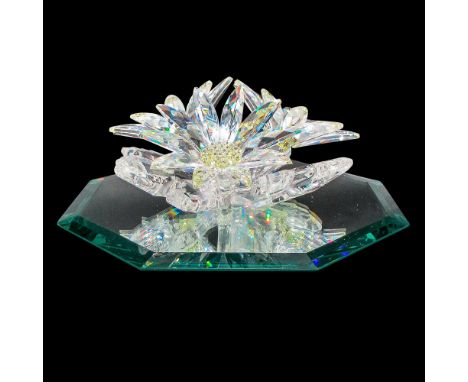 Part of Exquisite Accents theme group. Clear multi-faceted petals with yellow crystal centers. Swarovski backstamp. 7478 000 