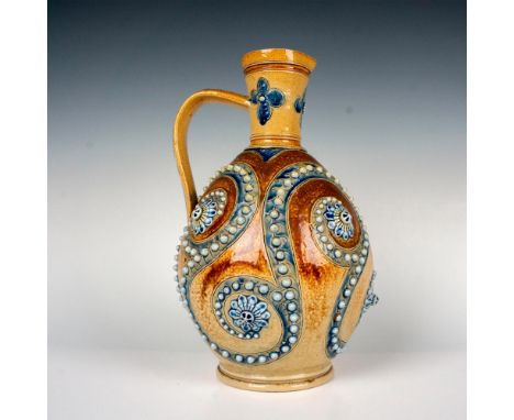 A beautiful rare salt glaze pitcher designed by George Tinworth. Blue incised scrolls adorned with white beaded reliefs and r