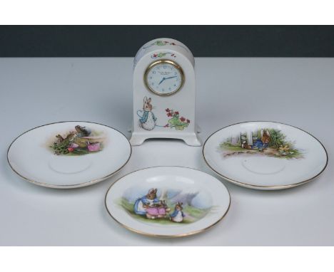 Wegdwood Peter Rabbit small mantle clock together with two Peter Rabbit Beatrix Potter Grimwades saucers and a similar small 