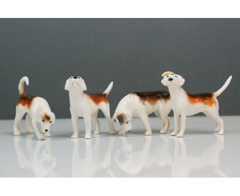 Four Beswick foxhounds, Model no. 941 first version; Model no. 2263 second version; Model No. 944 first version and model no.