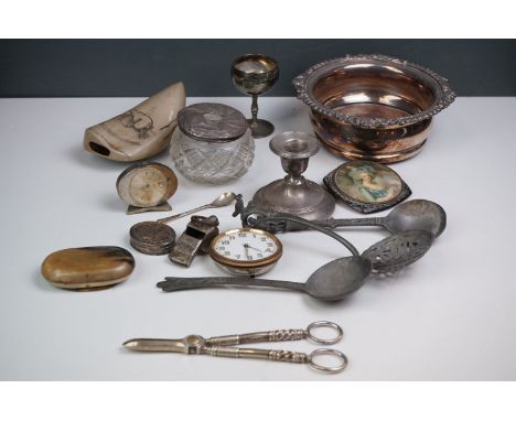 Collection of items to include bottle coaster, silver dwarf candlestick, ladies compact, silver pill box, Aussie whistle, tra