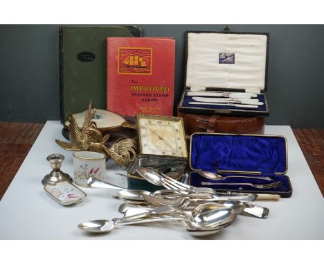 A box of mixed collectables to include a hallmarked silver candlestick, a cased hallmarked silver fork and spoon set, silver 