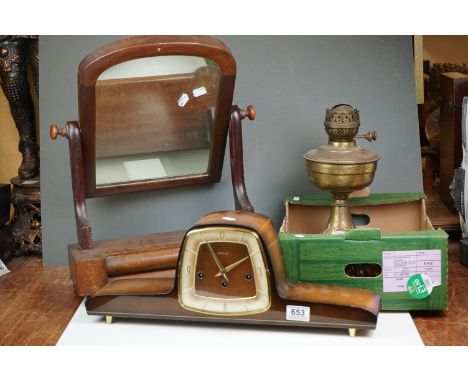 A vintage wooden cased chiming mantle clock together with a table mirror and a paraffin lamp. 