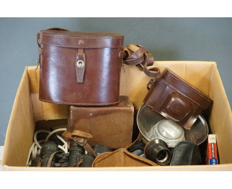 A collection of vintage camera equipment and binoculars to include Canon and Kodak examples. 