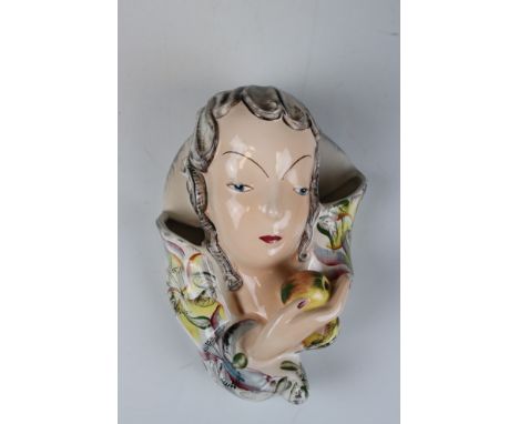 Early 20th century Goldscheider Wall Pocket in the form of a Lady holding an Apple, 19cms high 