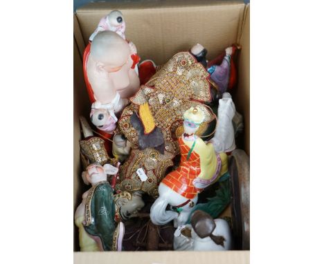 A group of collectable oriental ceramic figurines and an Asian String Puppet 