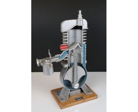 Cast Cut-away Demonstration Model of a Two-stroke Engine by Irwin &amp; Partners Ltd of Croydon, on wooden plinth, 45cms high